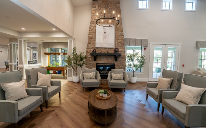 seating area with chairs and coffee table and a fireplace in the background